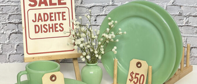 Jadeite dishes displayed with price tags at a local market-style setup, including a mug, plates, and bowls with a 'For Sale' sign.